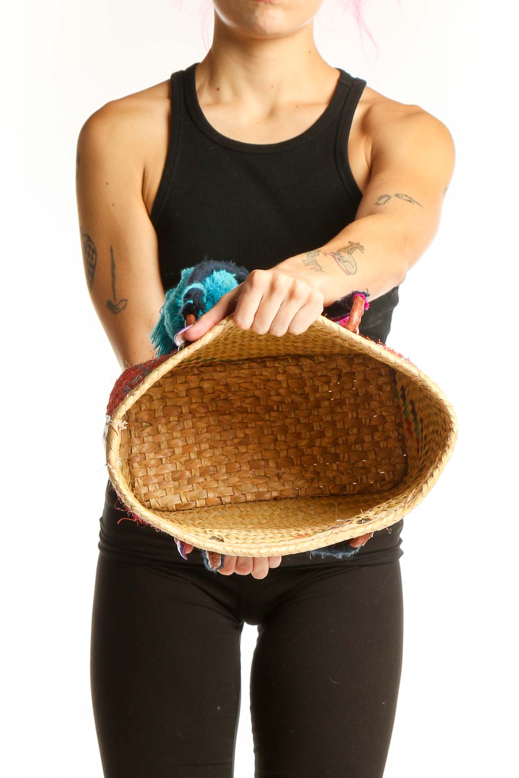 Back view of red woven SilkRoll tote bag showing geometric design and decorative tassel embellishments