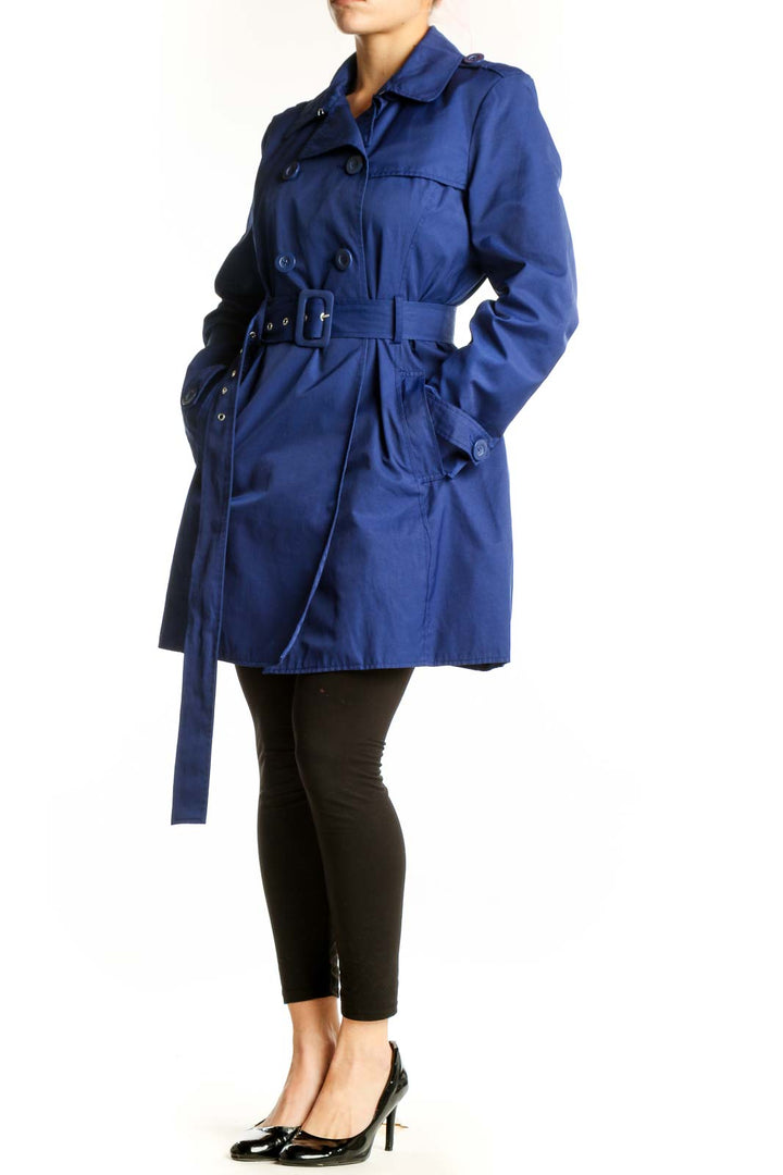 Navy double-breasted trench coat with belted waist and long sleeves, front view