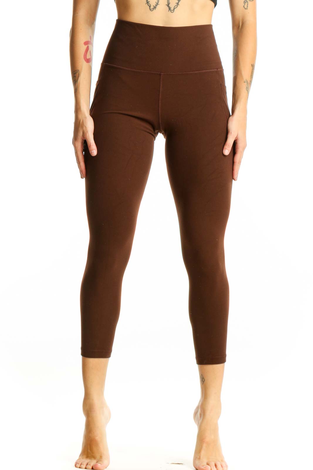 Front view of brown high-waisted capri leggings from Athleta