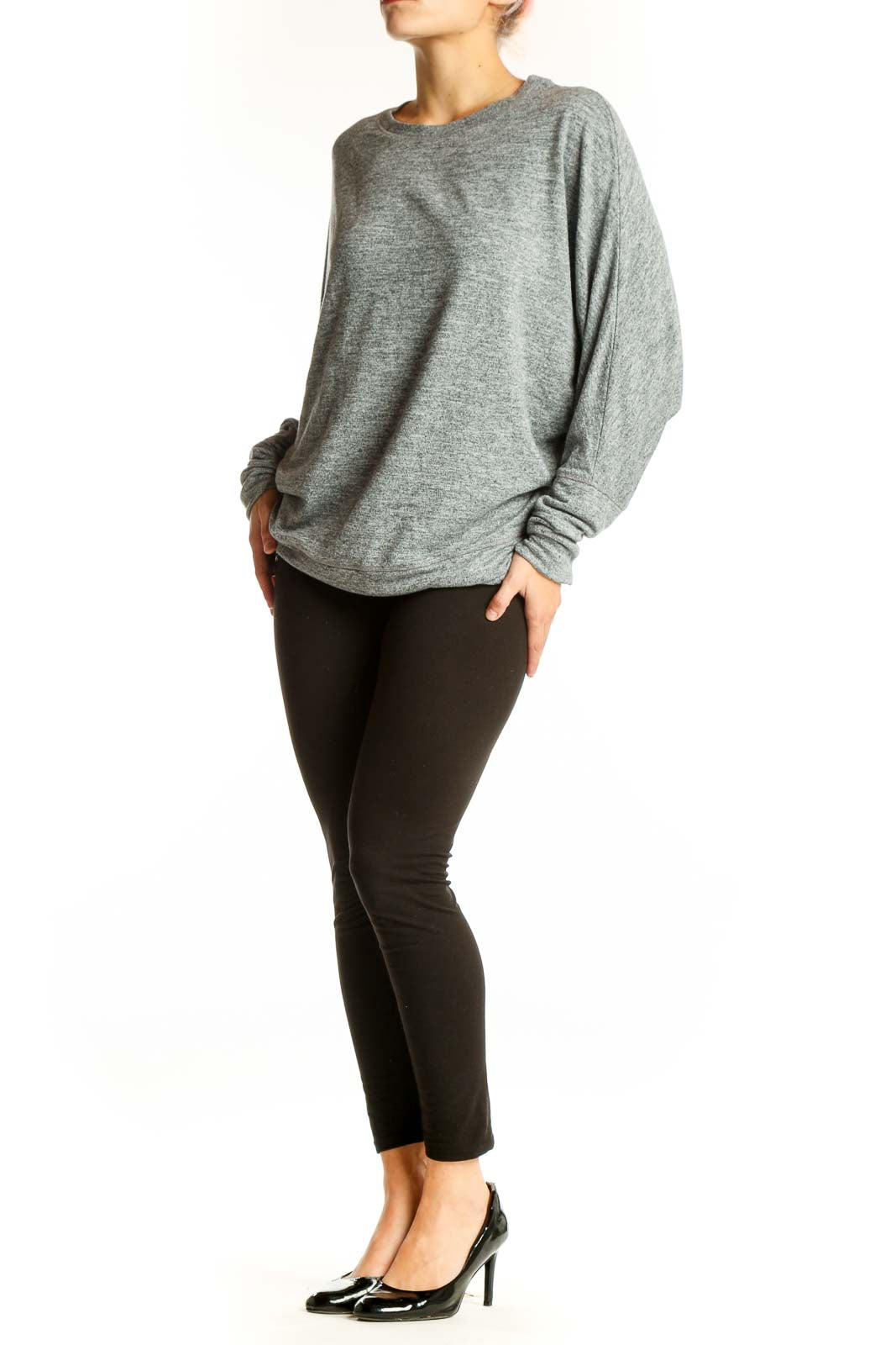 Front view of gray oversized knit sweater with long sleeves