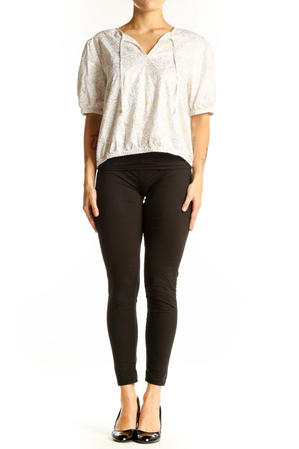 Front view of Michael Kors white cotton blouse with floral embroidery and puff sleeves