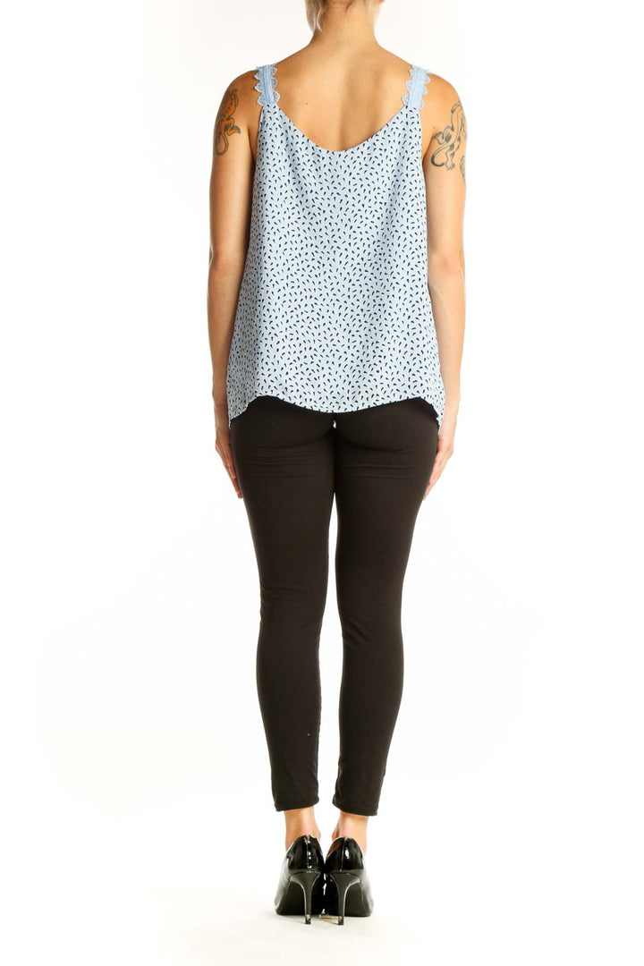 Side view of light blue floral print camisole top showing relaxed fit