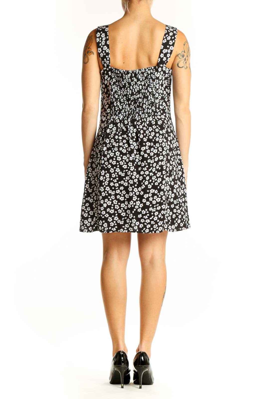 Side view of Gap black floral print dress showing A-line silhouette