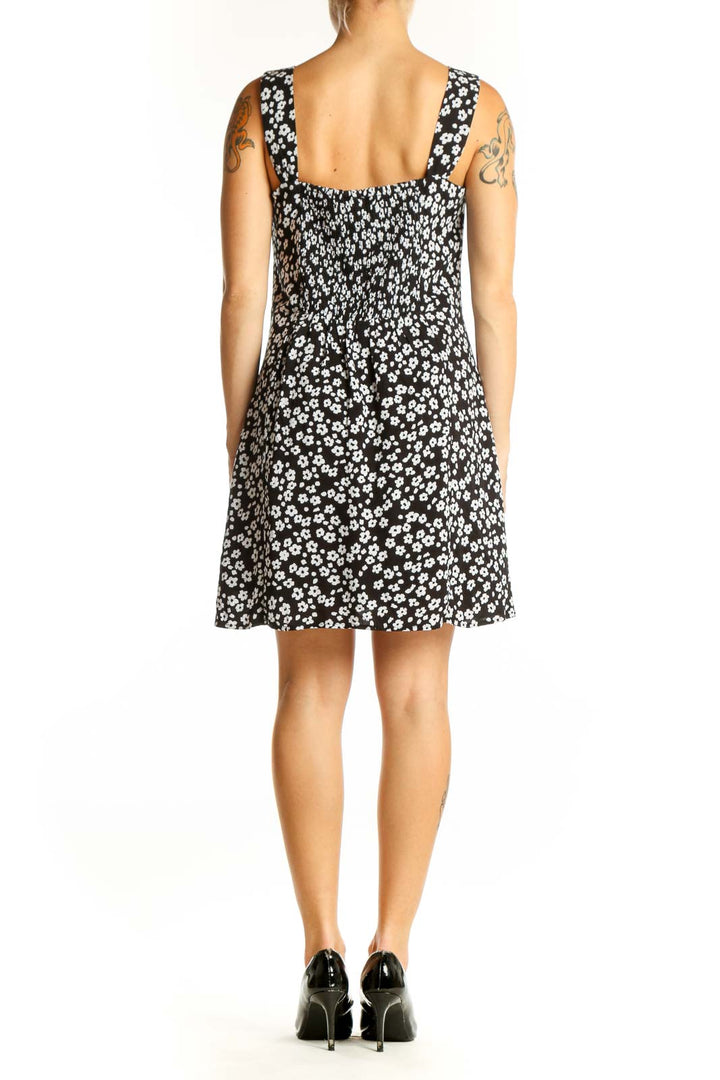 Side view of Gap black floral print dress showing A-line silhouette
