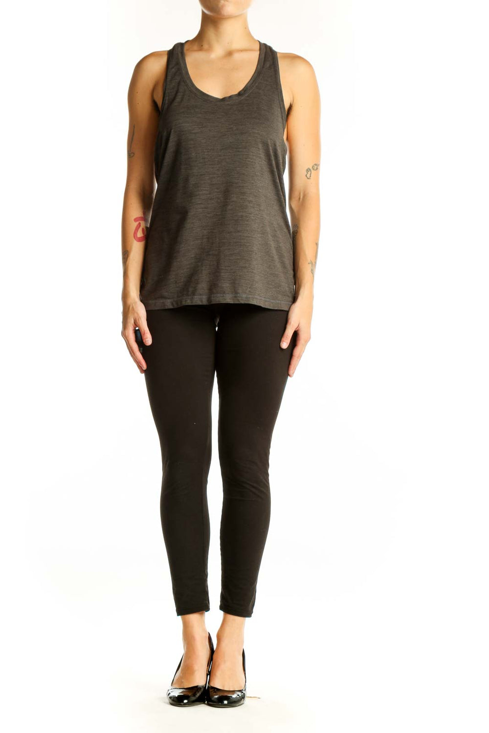 Front view of Vuori olive green racerback tank top on model