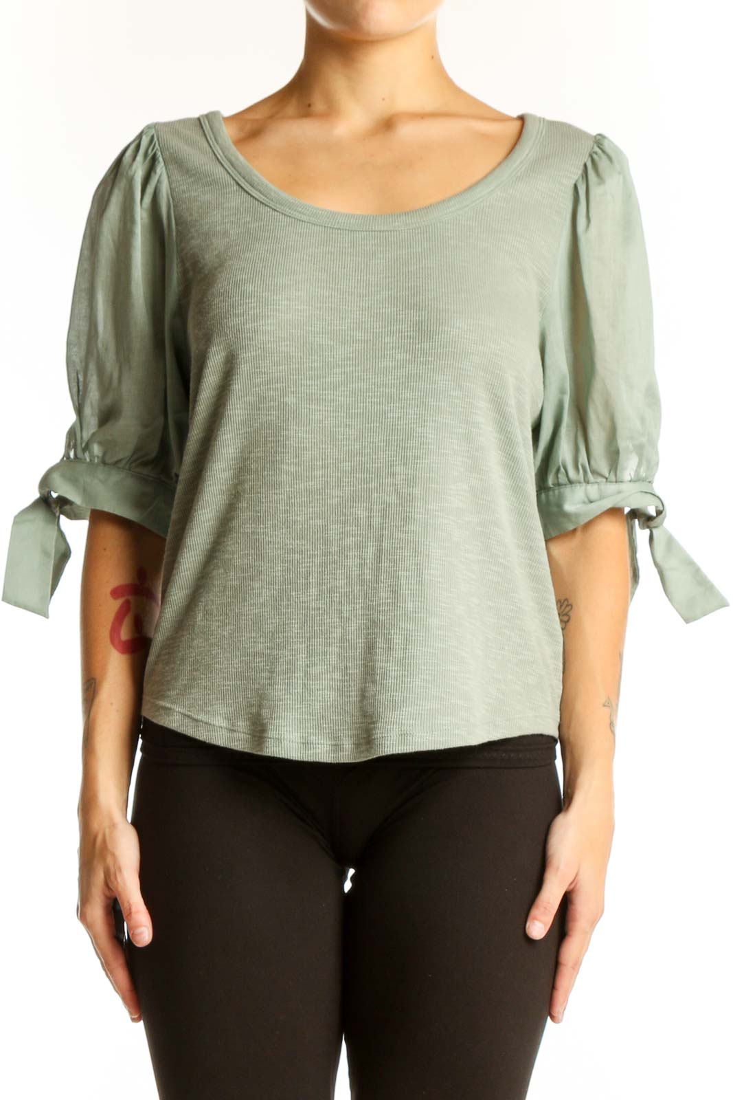Front view of sage green Gap top with puff sleeves and ribbed texture