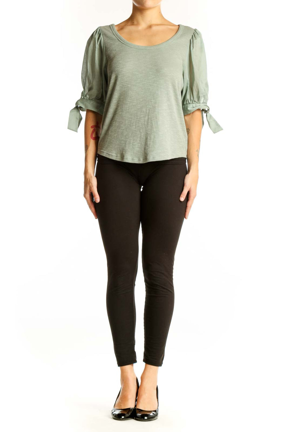 Front view of sage green Gap top with puff sleeves and ribbed texture