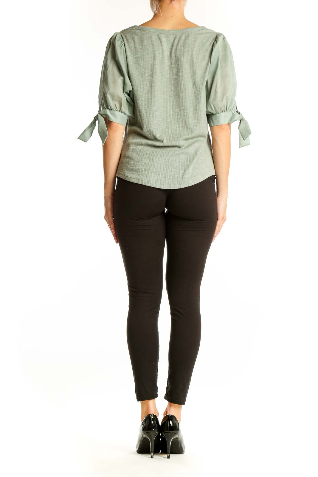 Side view of sage green Gap top showing puff sleeve detail and fit