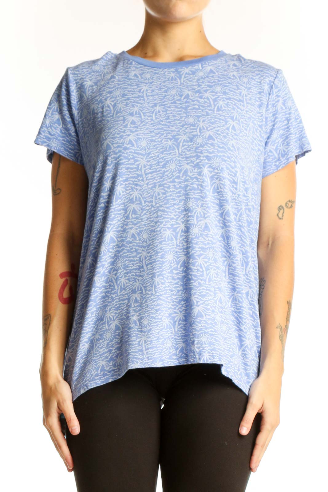 Front view of blue Marine Layer top with palm tree print