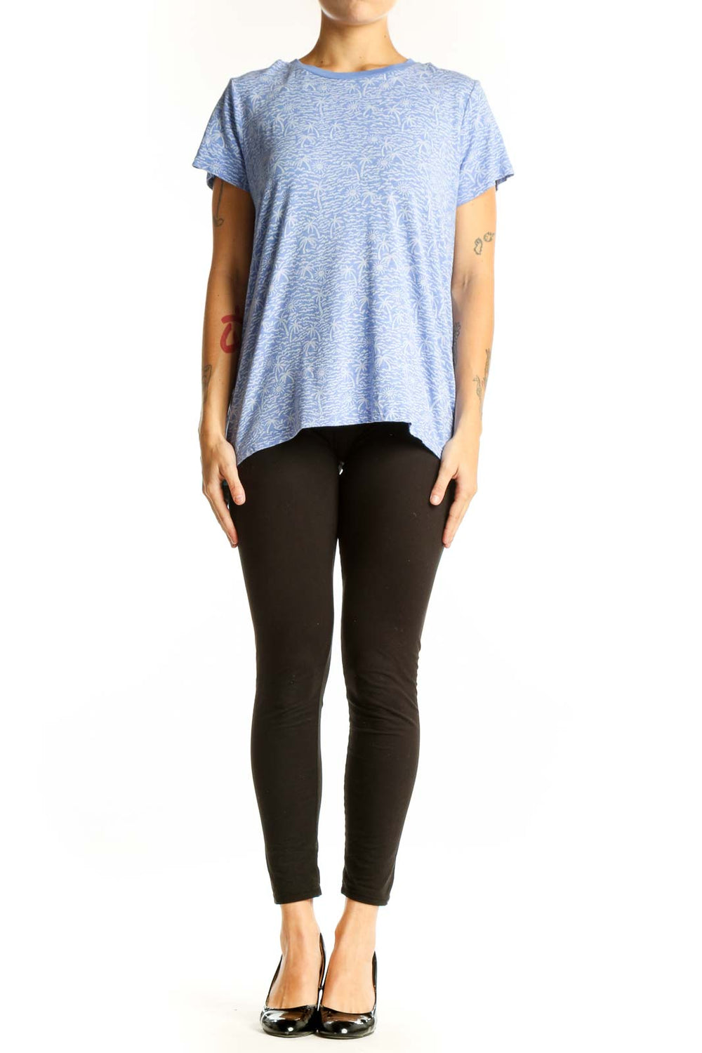 Front view of blue Marine Layer top with palm tree print