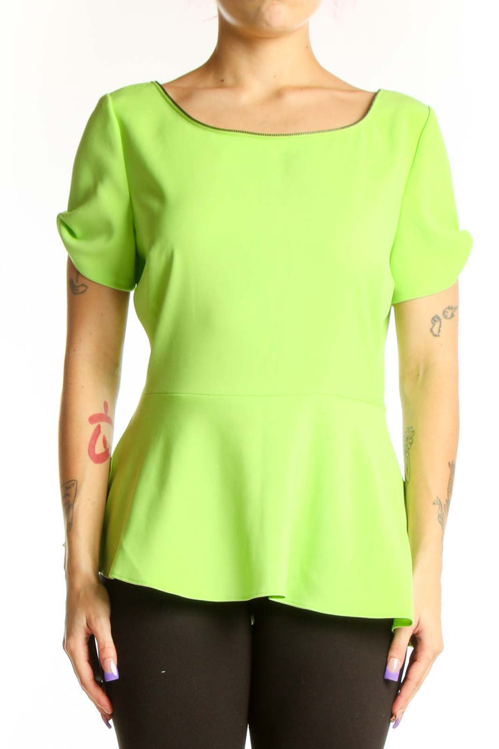 Lime green peplum top with short puffed sleeves and boat neckline, front view