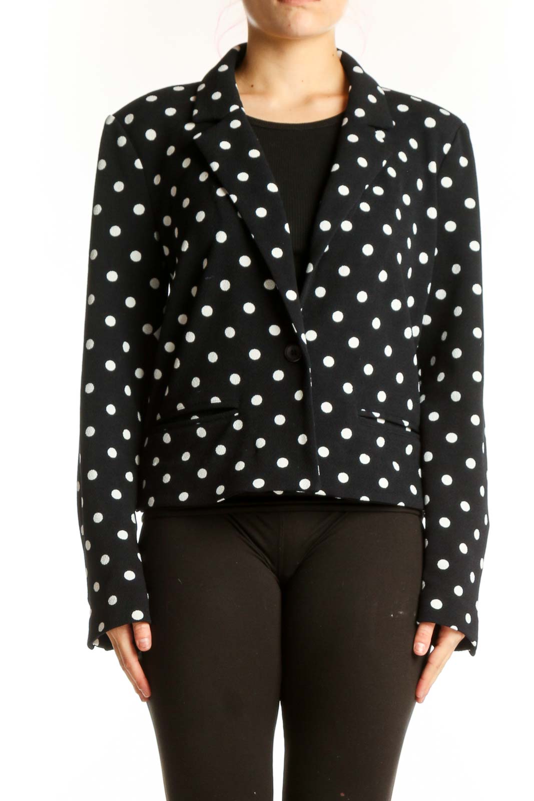 Black polka dot blazer with white dots, cropped fit, front view on model
