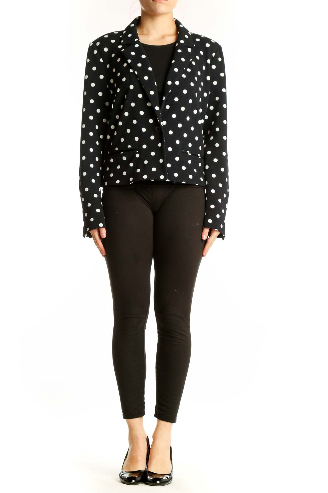 Black polka dot blazer with white dots, cropped fit, front view on model