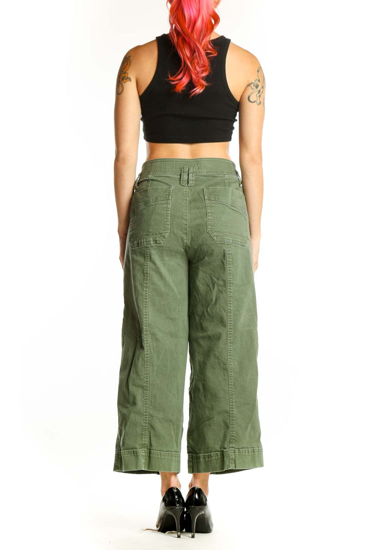 Back view of sage green cargo cropped pants showing rear pockets and cropped length