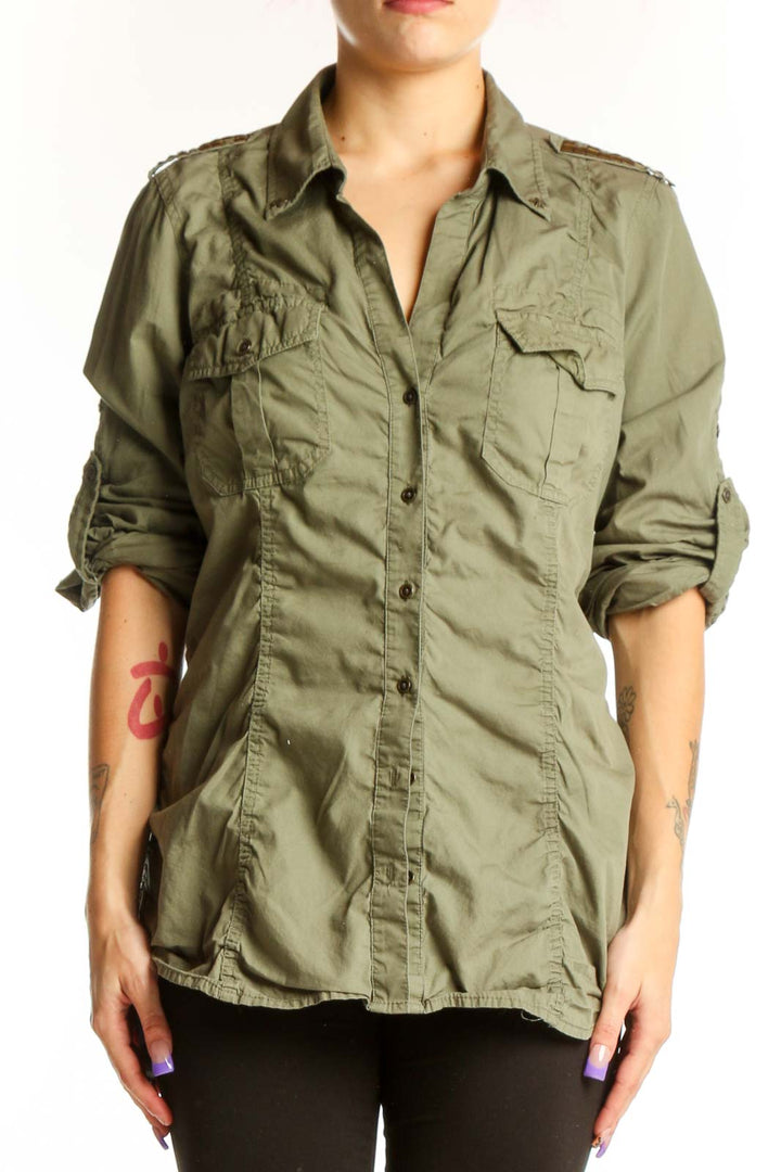 Sage green cotton military shirt by Express with dual chest pockets and button-up front, worn with black leggings