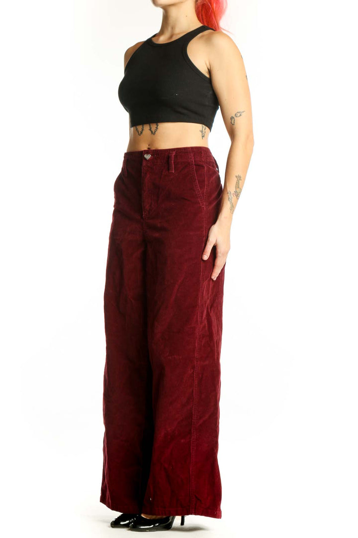 Burgundy velvet wide-leg pants by Celebrity Pink, front view showing high-waisted fit and classic five-pocket design