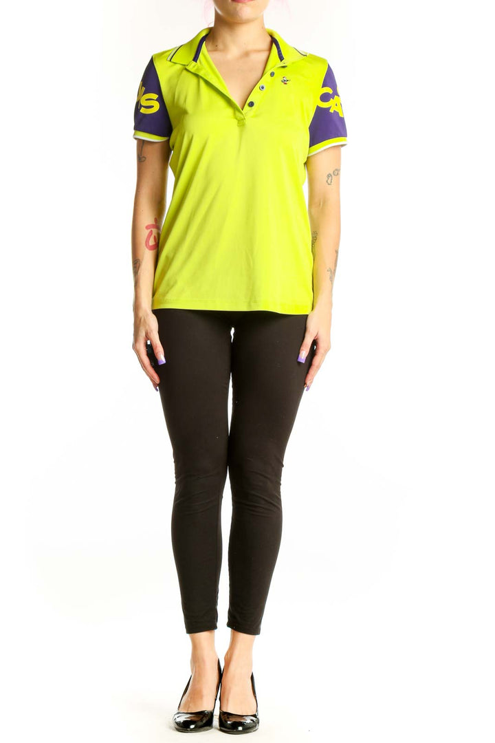 Front view of neon yellow polo shirt with purple sleeves and graphic detailing by Louis Castel