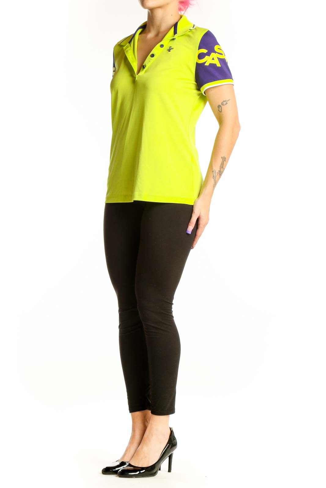 Front view of neon yellow polo shirt with purple sleeves and graphic detailing by Louis Castel