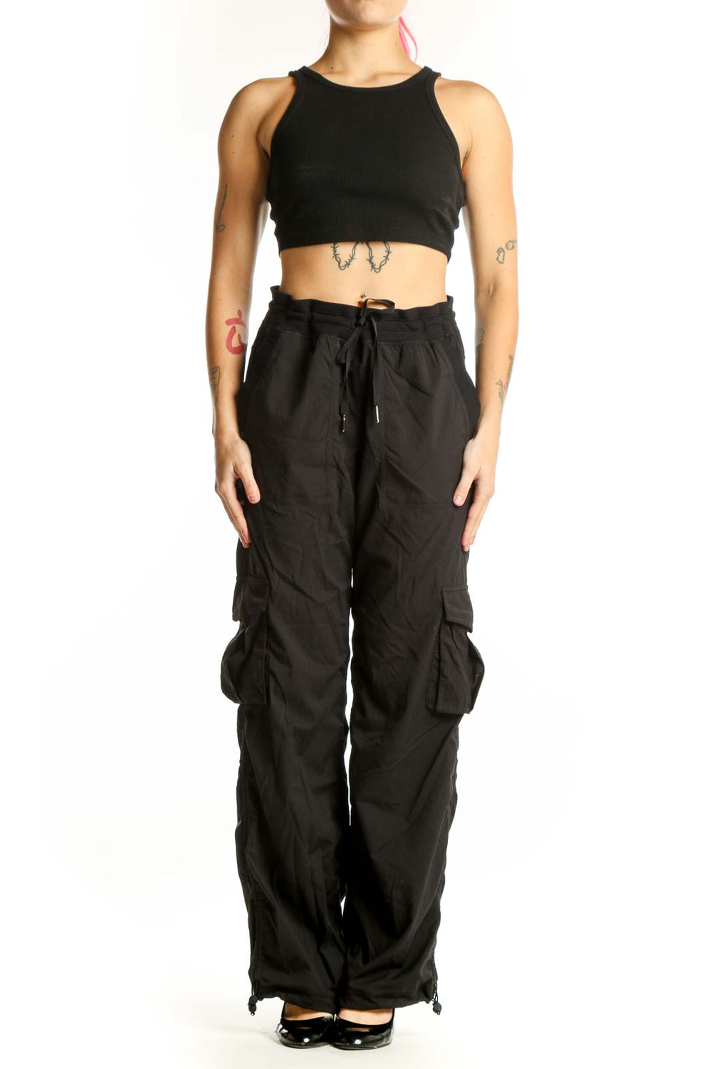 Black cargo pants with side pockets and drawstring waistband, front view