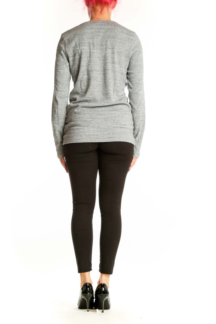 Gray long sleeve crew neck top by Maje with fitted silhouette, back view