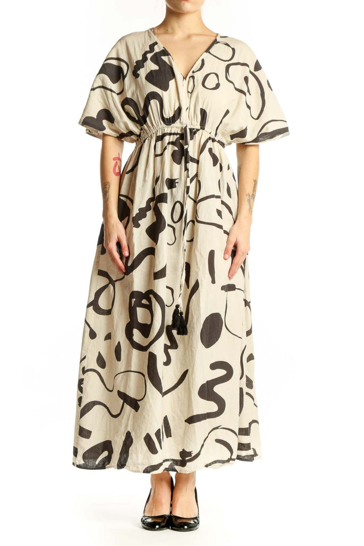 Cream and black abstract print midi dress with V-neckline and flutter sleeves, front view
