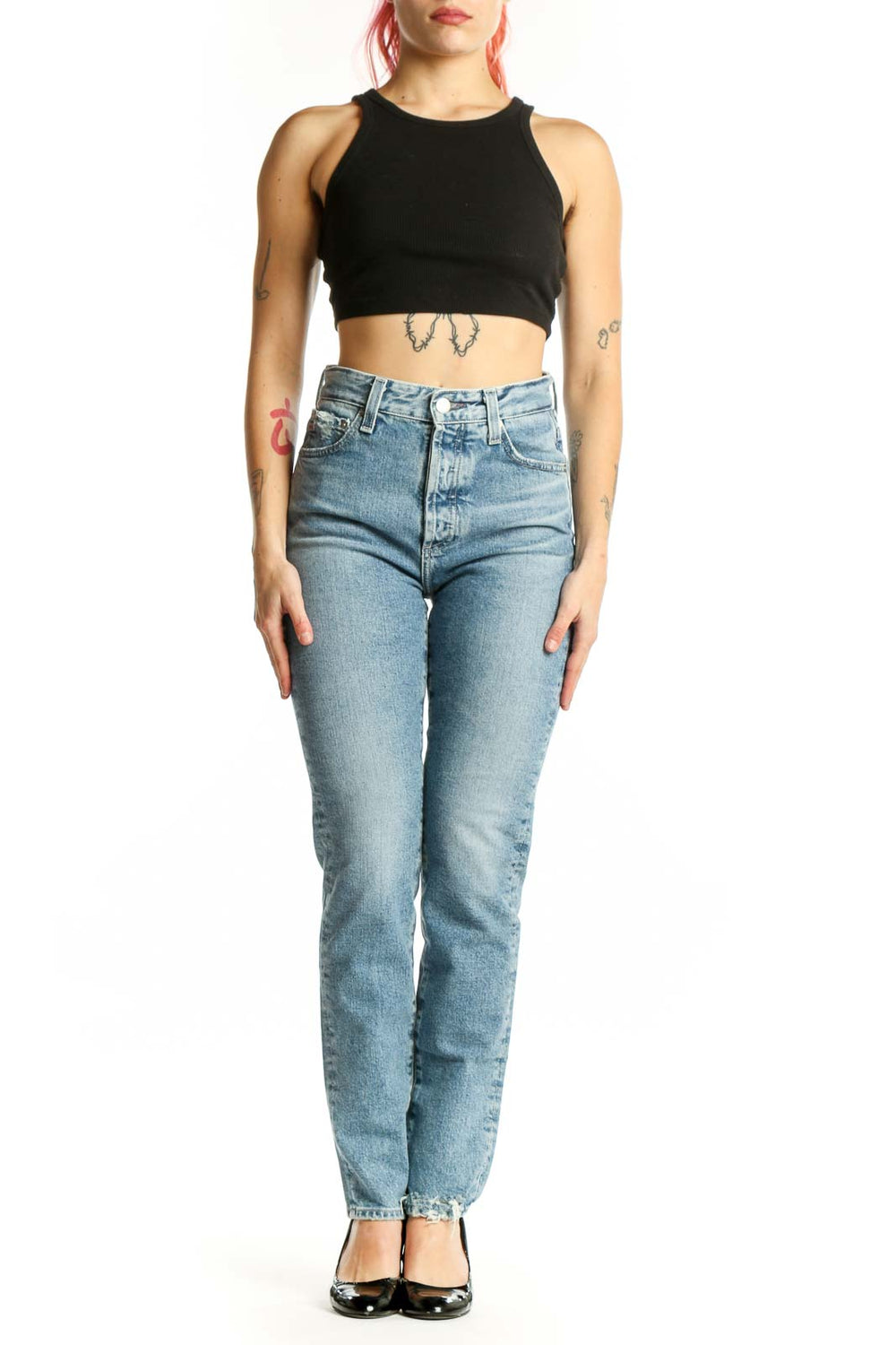 Front view of light blue AG straight leg jeans on model, showcasing classic five-pocket design and flattering fit