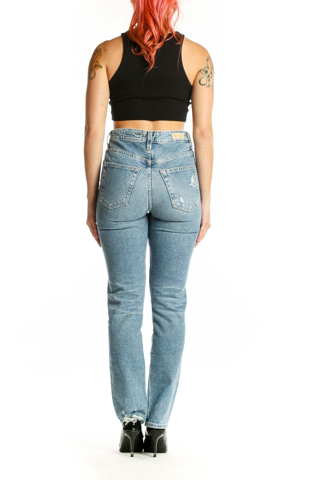 Side view of light blue AG straight leg jeans, displaying the straight leg silhouette and quality denim construction