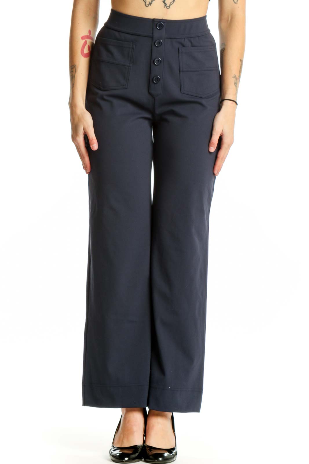 Navy high-waisted button-front pants with functional pockets, front view on model