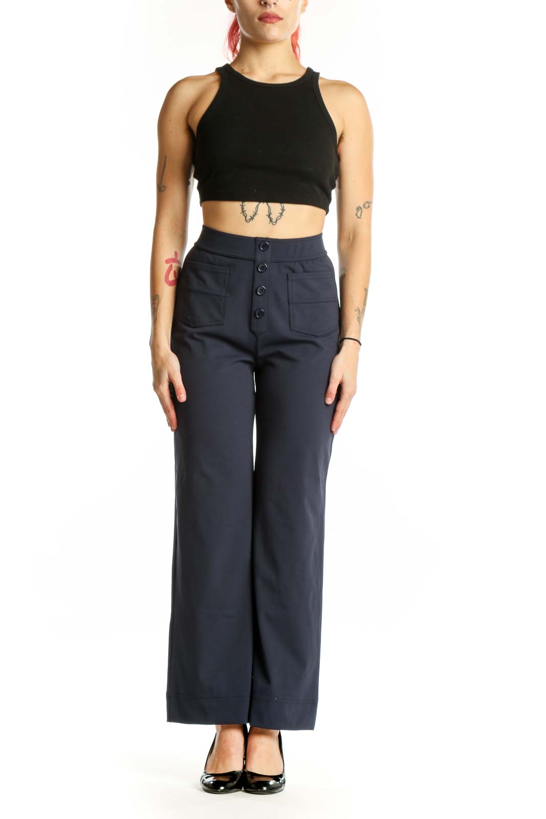 Navy high-waisted button-front pants with functional pockets, front view on model