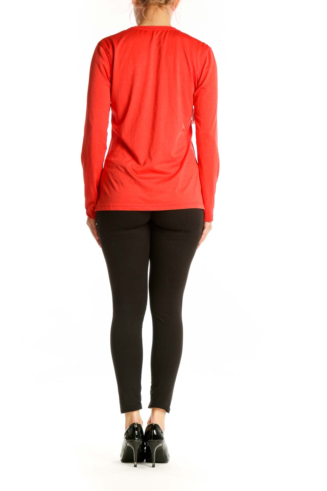 Red Nike long sleeve athletic top, back view showing minimalist design