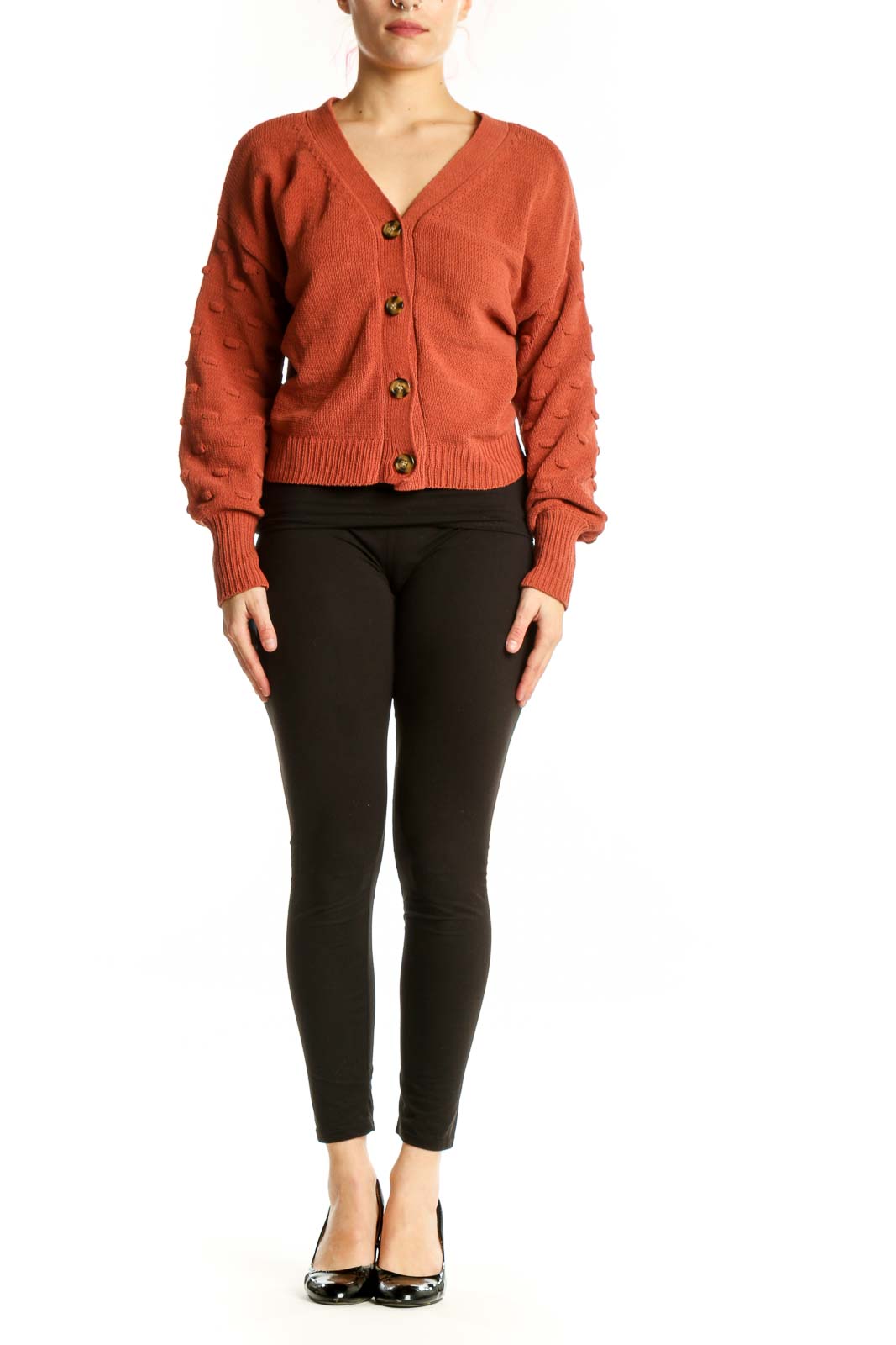 Front view of burnt orange textured button-front cardigan with V-neckline and wooden buttons