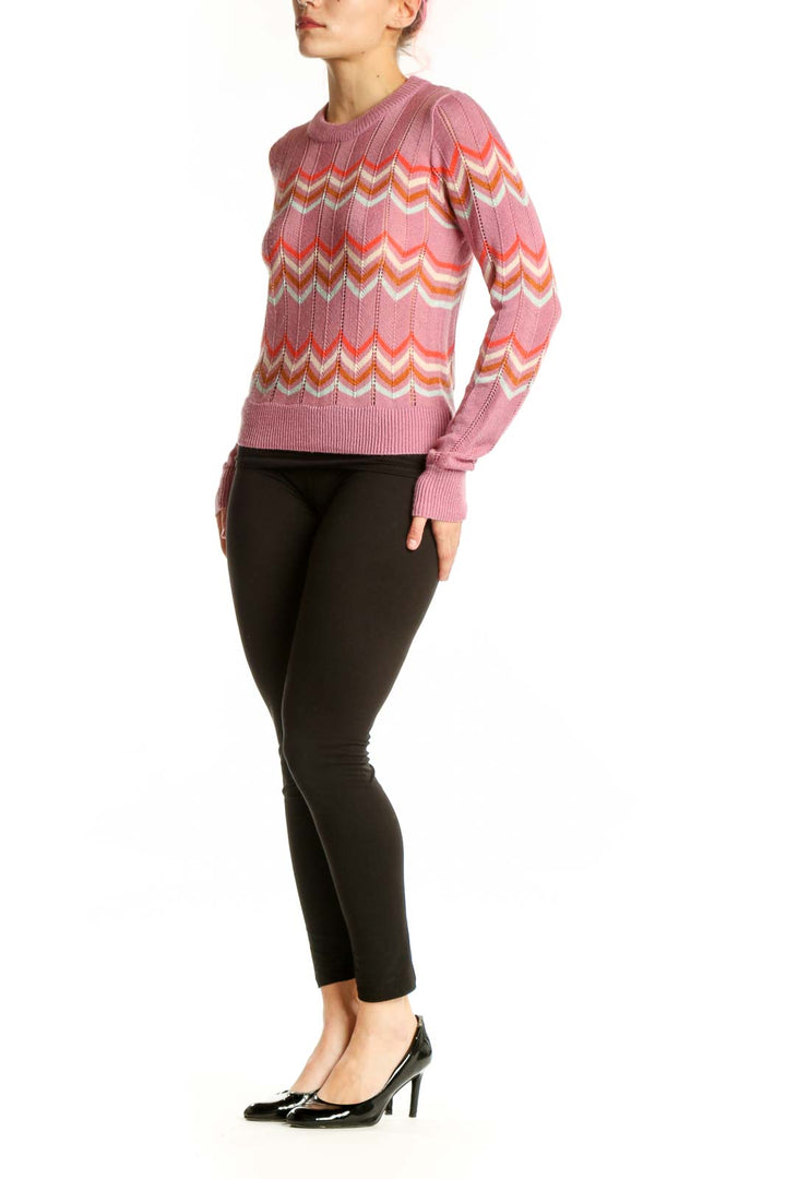 Pink chevron stripe knit pullover with coral, white, and gold geometric pattern, crew neckline, long sleeves