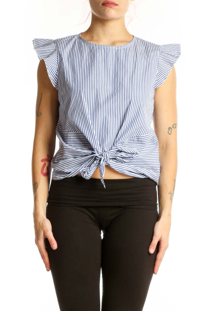 Blue and white striped Aqua top with ruffle sleeves and tie-front detail, worn with black pants