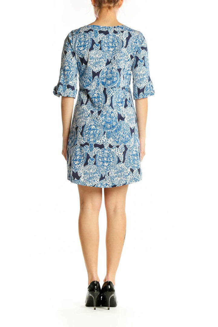 Blue abstract patterned Lilly Pulitzer shift dress with three-quarter sleeves, back view