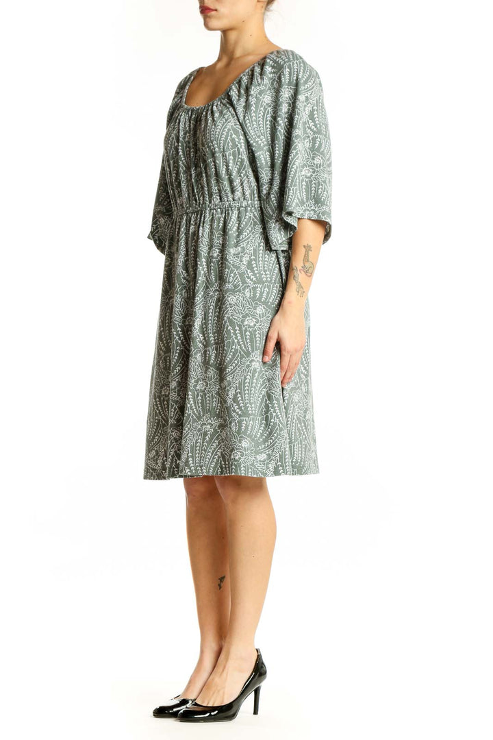 Green paisley print midi dress with flutter sleeves and gathered neckline, front view