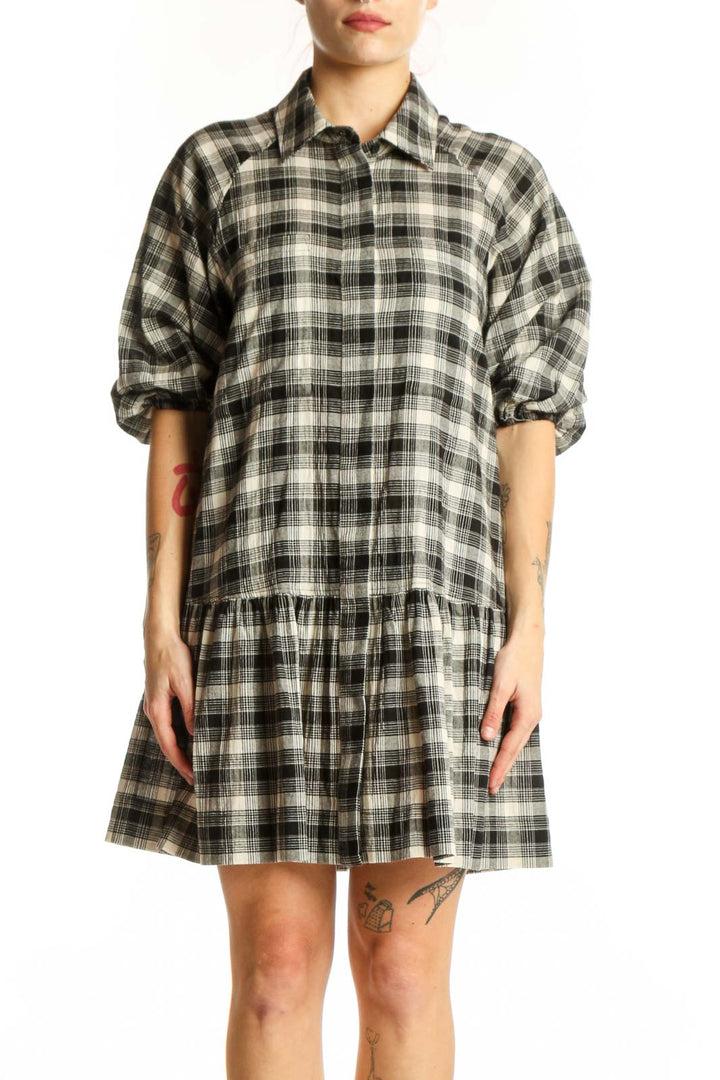Black and white plaid button-down shirt dress with peplum hem, front view