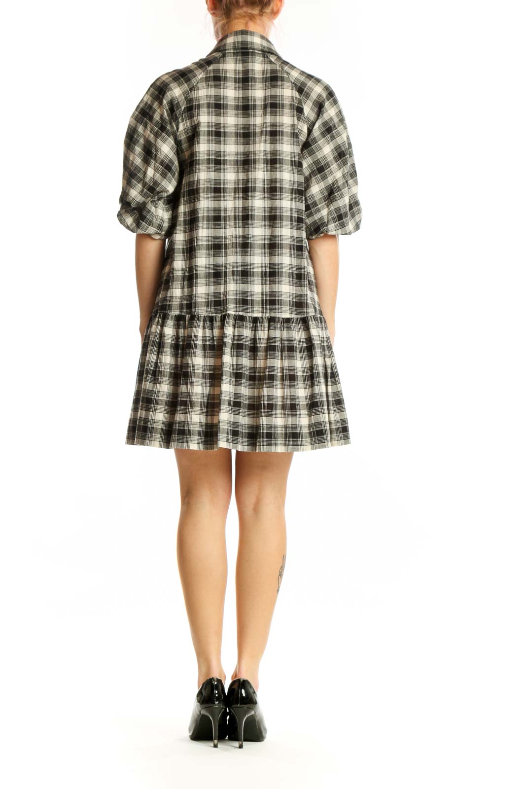 Black and white plaid button-down shirt dress with peplum hem, back view