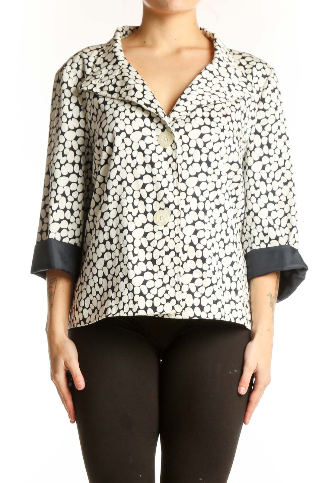 Cream and black polka dot Sag Harbor button-up jacket with black contrast cuffs, front view on model