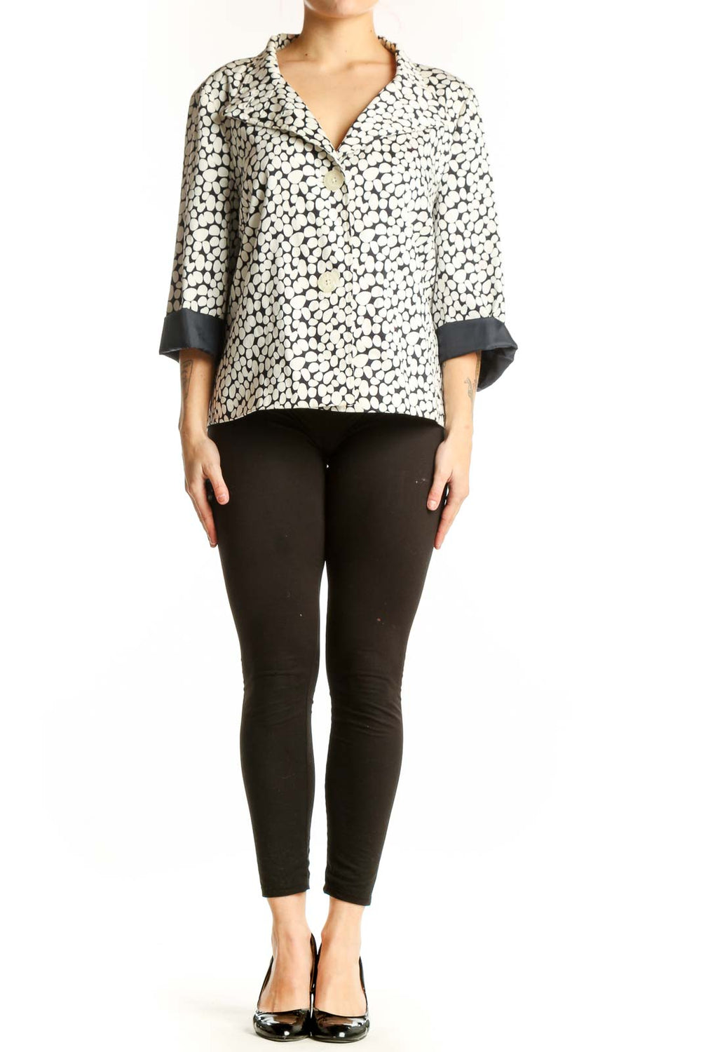 Cream and black polka dot Sag Harbor button-up jacket with black contrast cuffs, front view on model