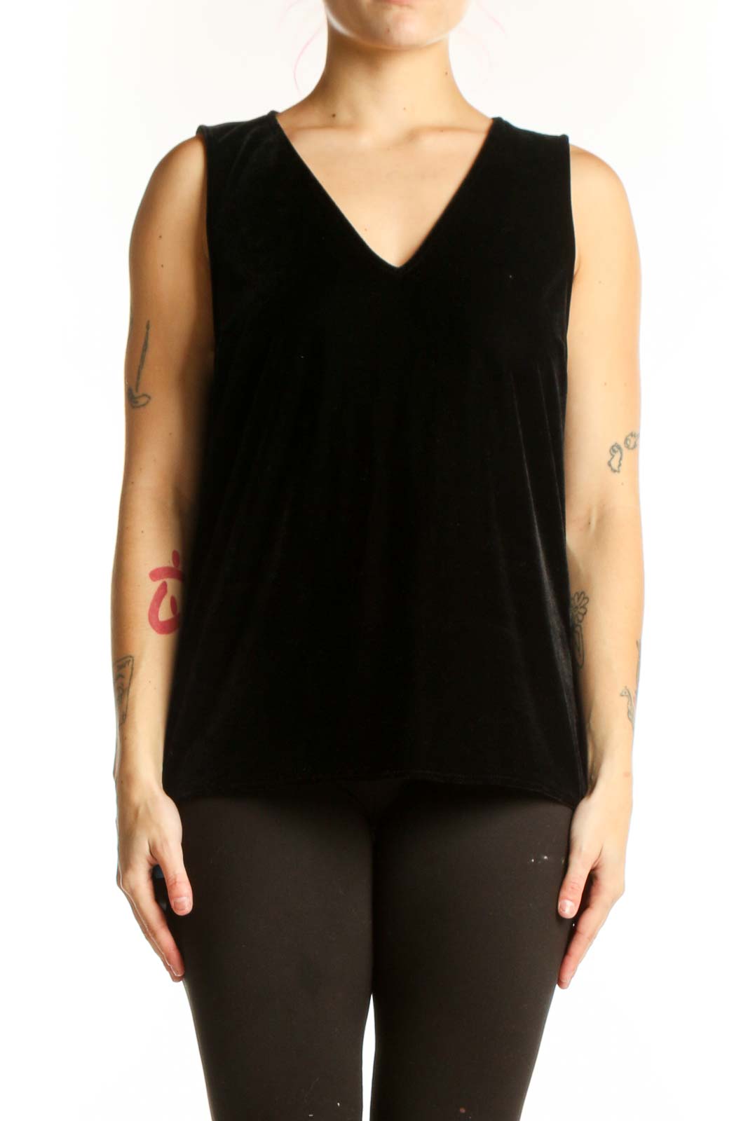 Black velvet sleeveless tank top with V-neckline, front view on model