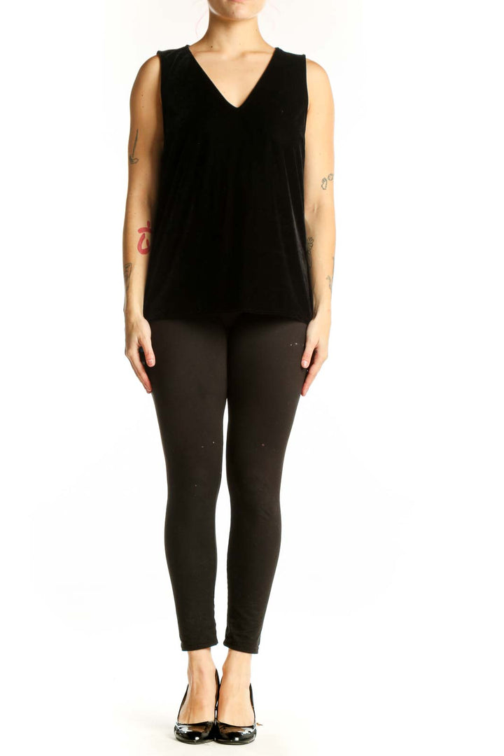 Black velvet sleeveless tank top with V-neckline, front view on model