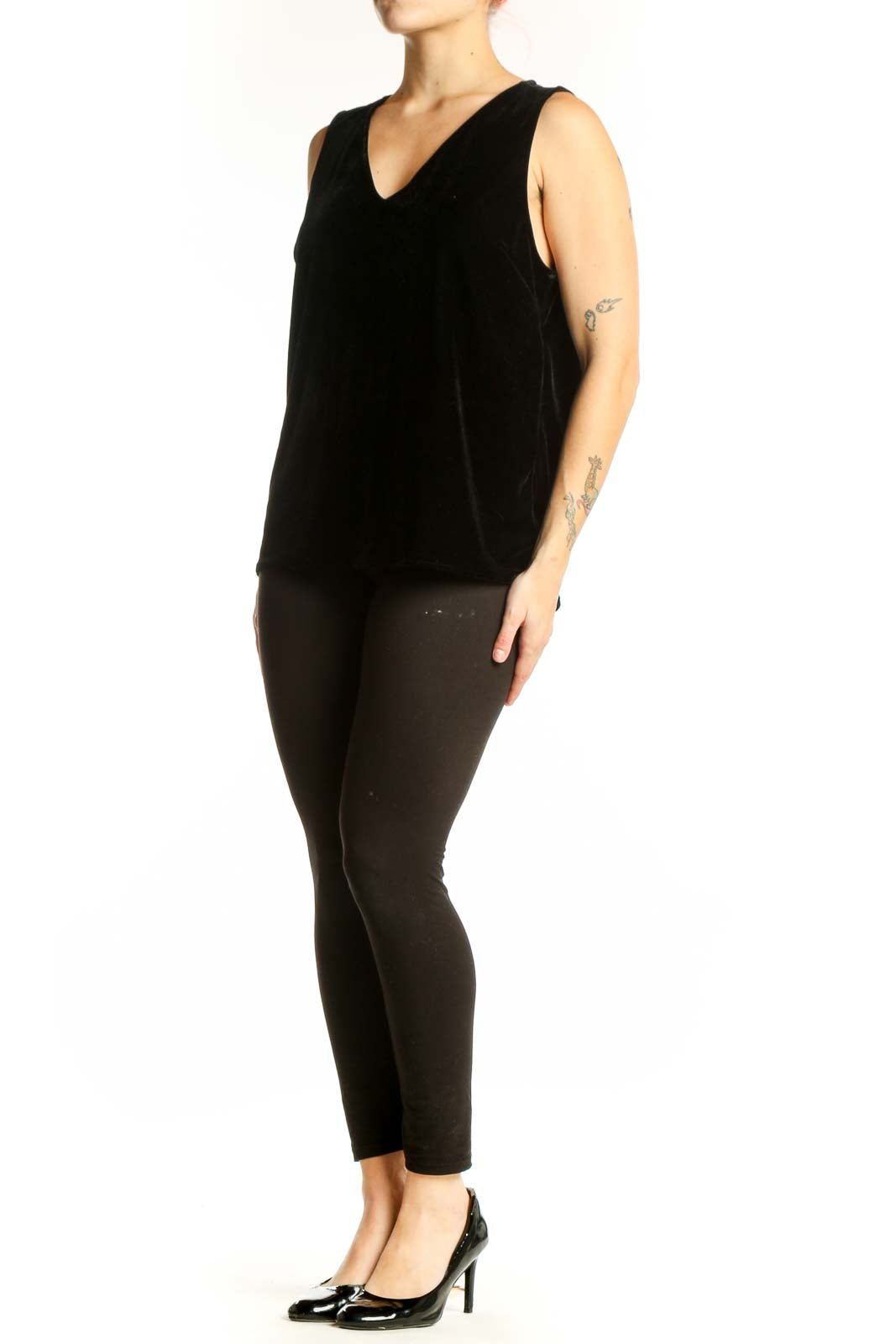 Black velvet sleeveless tank top with V-neckline, front view on model