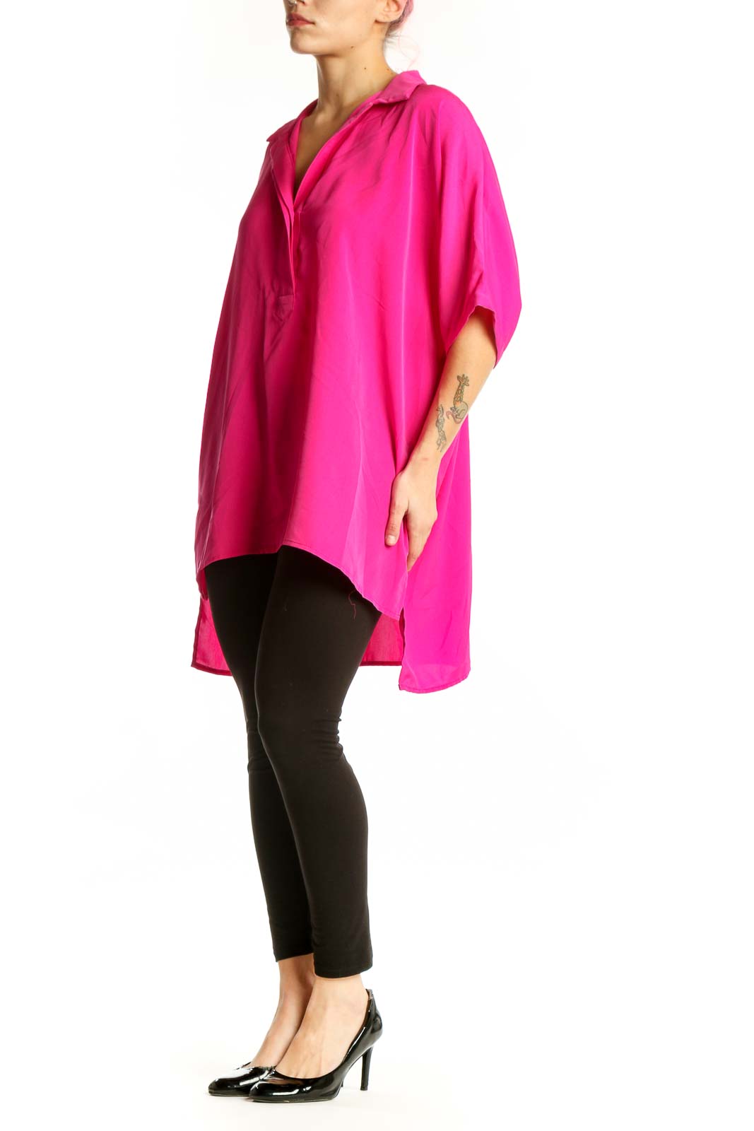 Front view of pink oversized button-up shirt with collar and rolled sleeves on model