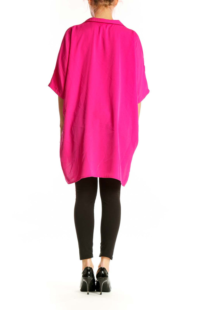 Back view of pink oversized button-up shirt showing relaxed fit and length