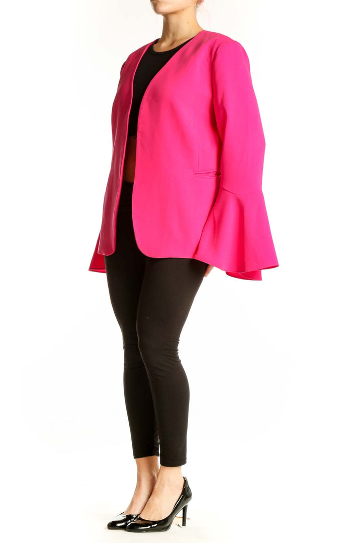 Front view of pink bell sleeve blazer jacket with open front design and black trim