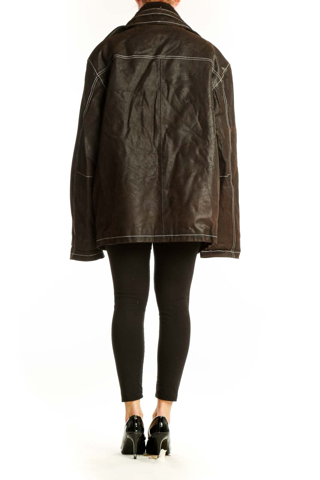 Back view of black leather jacket showing contrast stitching details and pocket construction