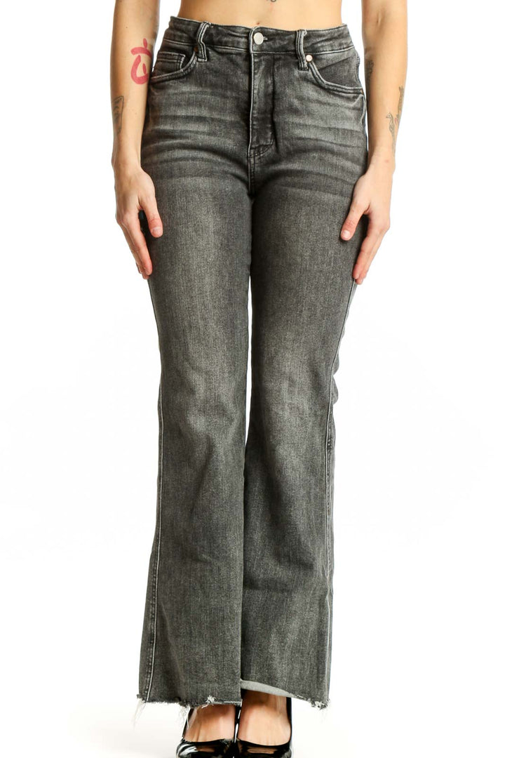 Front view of gray flare denim jeans by JUDY BLUE with high-rise waist and distressed hem detail