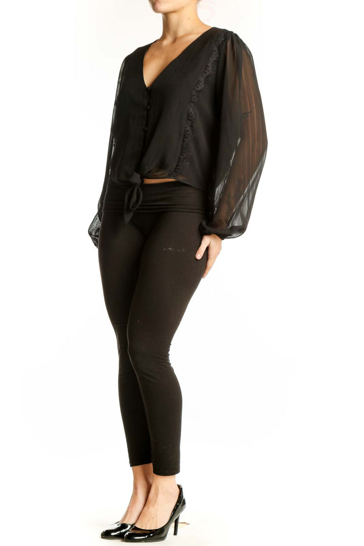 Black sheer ruffle tie-front blouse with V-neckline and voluminous sleeves, front view