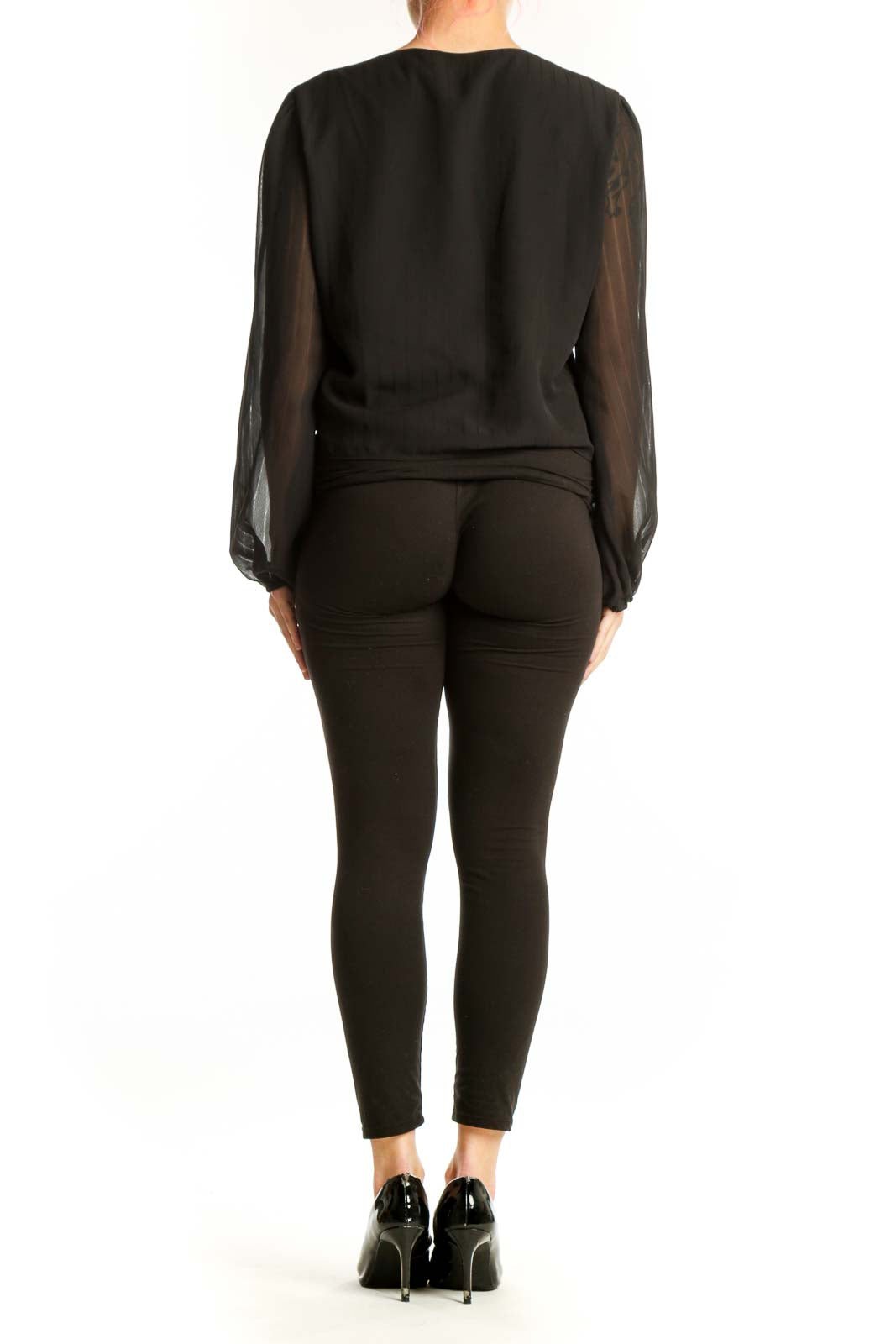 Black sheer ruffle tie-front blouse with voluminous sleeves, back view showing cropped silhouette