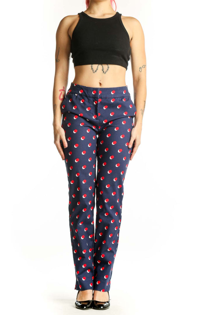 Navy Boden pants with red apple print, front view on model, size S